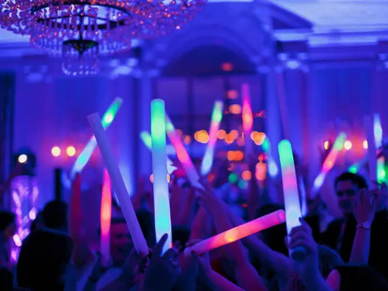 125 LED foam sticks lighting up a packed dance floor