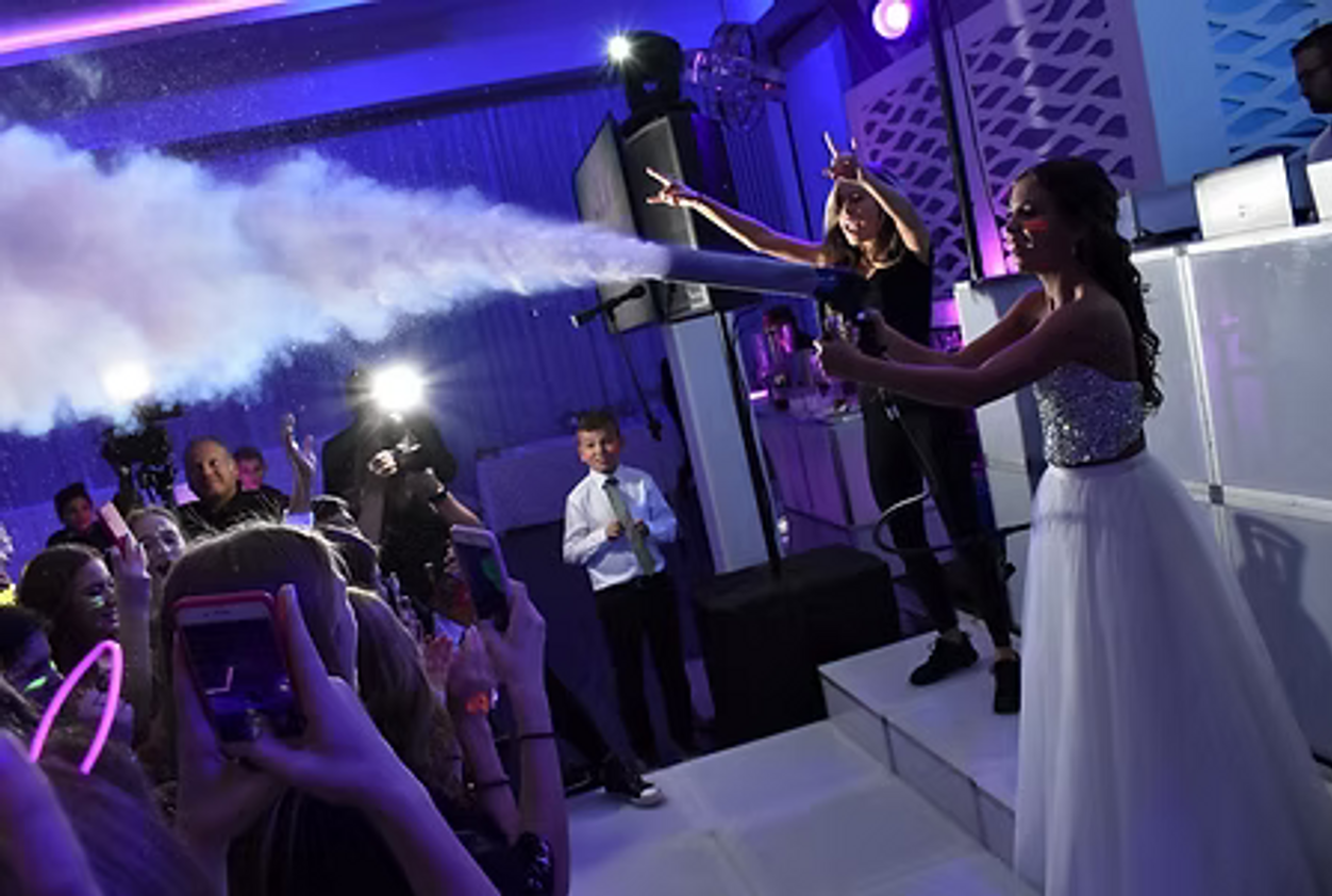 Sound and AV production rig — DJ booth, line array, intelligent lighting